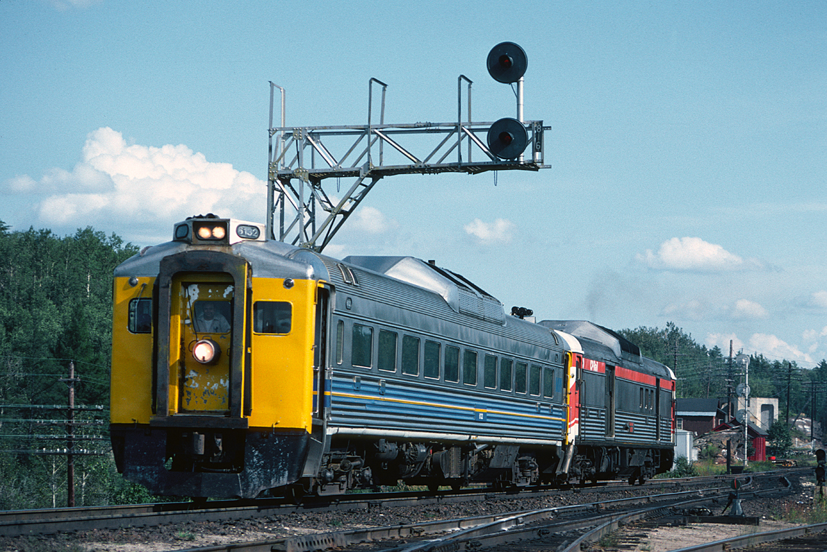 Westbound Budd cars leaving Franz Station on a pleasant summer afternoon.