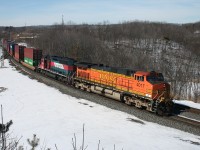 CN X150, a BNSF detour train from Tacoma, Washington rolls through Bayview behind BNSF 4017 and Ferromex 3215