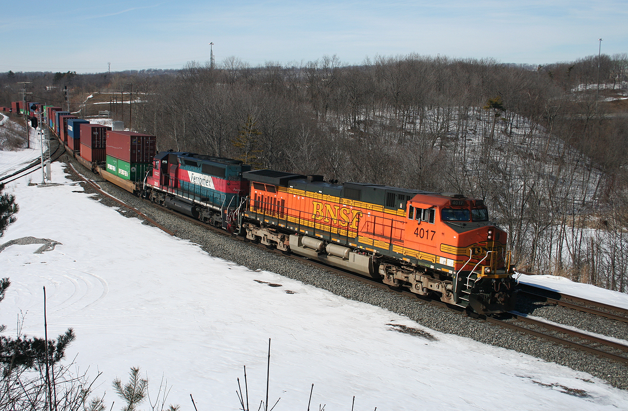 CN X150, a BNSF detour train from Tacoma, Washington rolls through Bayview behind BNSF 4017 and Ferromex 3215