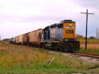 On a mostly overcast day, CSX D924 lead by Canadian assigned GP38-2 2672, heads back to Sarnia with 10 cars he picked up along the line.