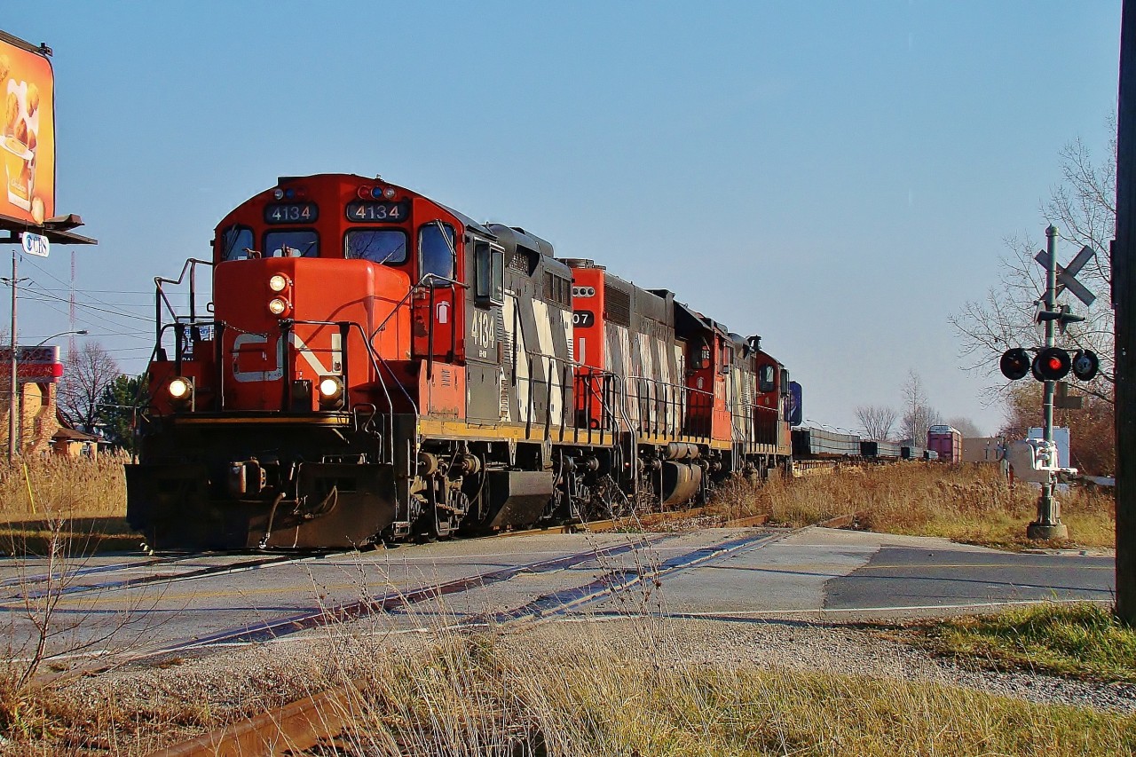 CN 4234 leads 4707 & 4115 with a handfull of cars over Howard ave. enroute to Van de Water yard about a mile ahead.