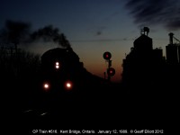 Alco smoke starts to roll out against the sunset as train #516 gets rolling after meeting a westbound in Kent Bridge.  I miss the sound of Big Alcos pulling hot shot containers on the Windsor Sub.