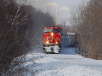 CN 520 climbing the hill from ste-foy QC to Joffre yard with CN dash9-44cw #2681 leading engine. We can see on the background the Laporte Bridge. 

-Entretien ABC-
