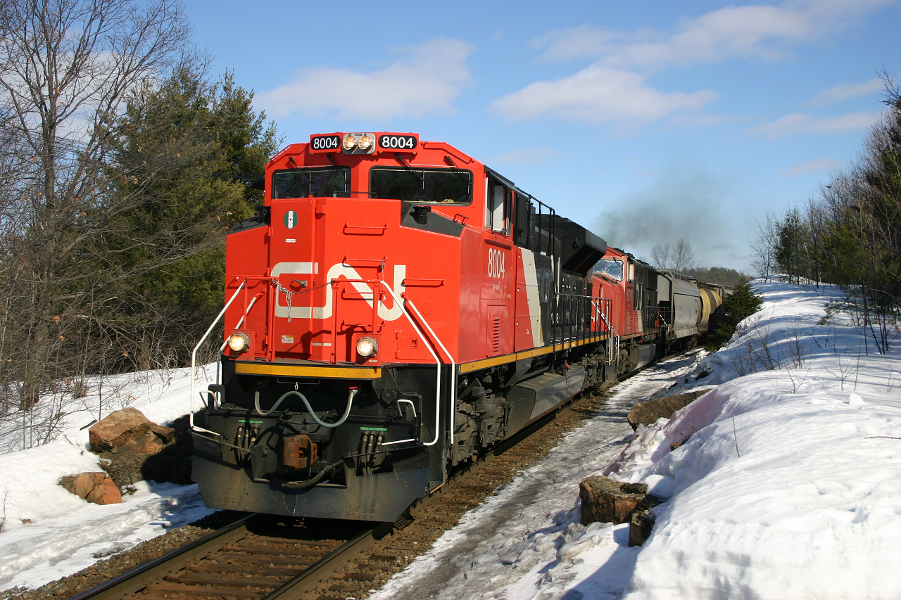 Brand new CN 8004 and CN 5718 accelerate train 201 north after a brief a crew change.