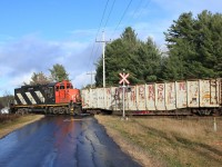 595 returning from Washago/Longford Mills crosses Old Muskoka Road reflected in the meltwater of a snowsquall that had just passed through.