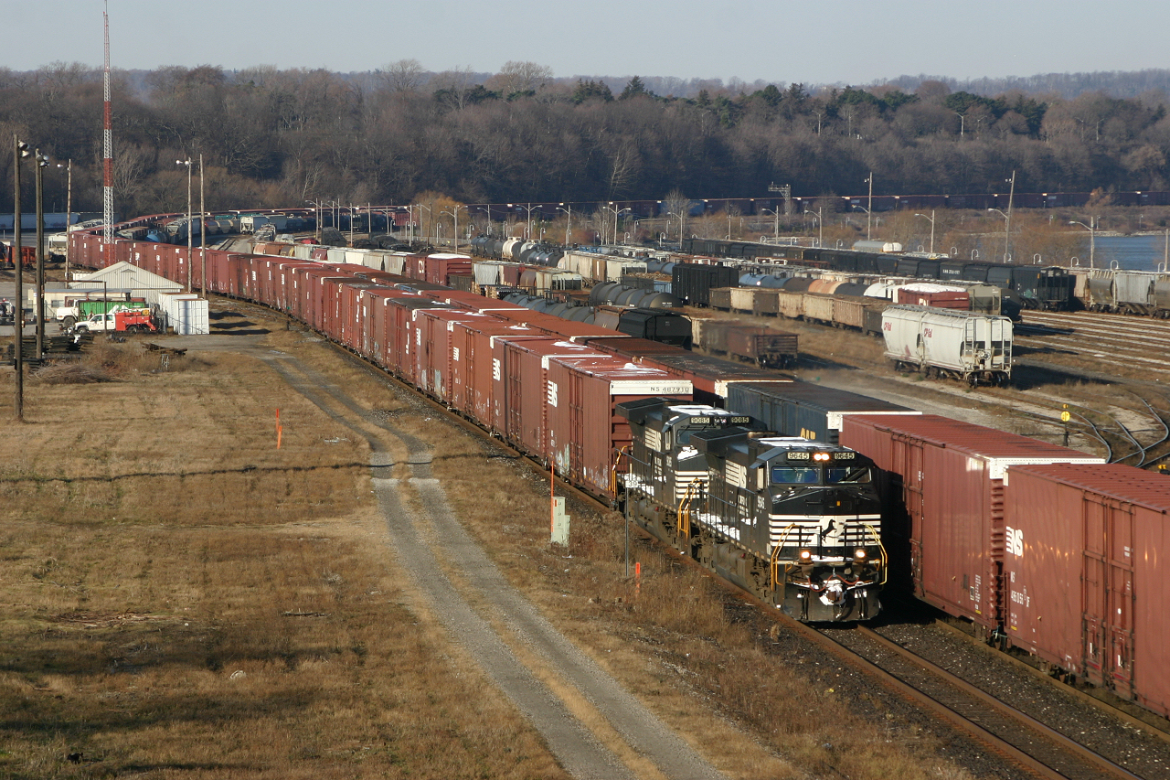 The end is near for NS operations in South-Western Ontario as NS 9645 and NS 9085 lead a massive 328 through Hamilton. Working the yard is CN 421 who, within a few short weeks will be handling NS 328's traffic.
