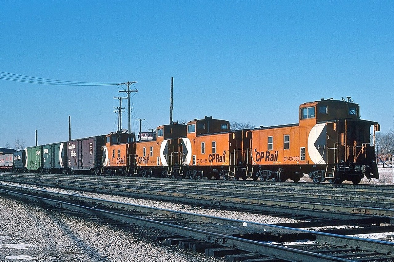 Four end of train devices – including CP Rail 434060 - on the tail end of the 8921-8769 powered westbound transfer. February 1, 1980 Kodachrome by S.Danko.