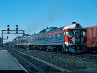 On an April 1977 Saturday morning a red over green over red signal indication sends CP Rail train #381 over the Leaside crossovers and down the hill to TTR trackage, past the Cherry Street tower and onto Toronto Union. The three RDC-1 Budd cars assigned to the Friday train #380 to Havelock were required due to heavy passenger load with the near empty Budds returning Saturday on #381. Kodachrome by S. Danko.