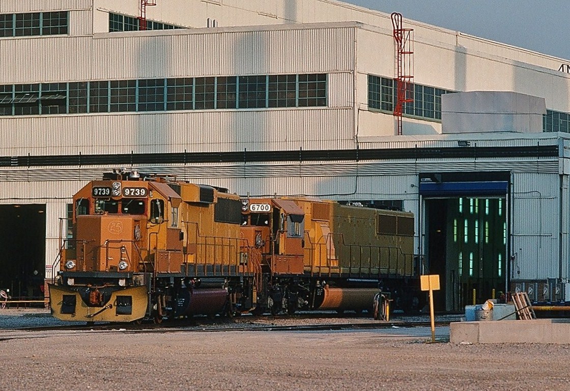 For all those GMDD'ophiles out there. Need your assistance. Through the fence at GMDD in May 1991, I believe these maybe demonstrators: GMDD 9739 and GMDD 6700 (or really EMD 9739 and EMD 6700?). Thoughts about these units? Comment? May 1991 London Ontario Kodachrome by S. Danko.