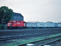 The recent CN Triple Crown images posted by Eric Portelli prompted me to dig out my CP Rail Triple Crown Kodachromes. So here is CP Rail GP 38-2 #3046 with the westbound (I believe this is westbound?) Triple Crown in London, Ontario - May 1991 ! [ Q: the building behind the unit:  is that the former CPR London Station?] Kodachrome by S. Danko.
