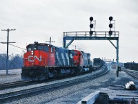 It is a dreary January 1980 afternoon as MLW M-420(W) #2536 and MLW M-636 #2333 team up on an eastbound extra at CN Paris Jct. My Trackside Guide shows the 2500's renumbered during 1986/7 into the 3500 series and divested between 1991 and 1998. The 2333 was retired by 1998.  Kodachrome by S. Danko.