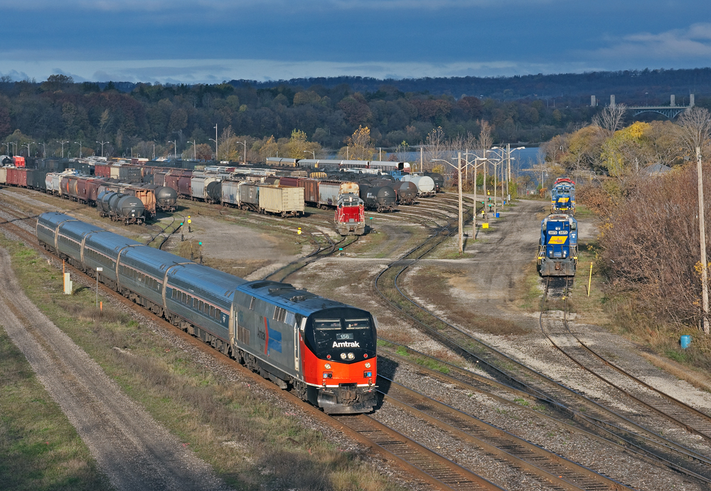 For the second time, one of Amtrak's heritage locomotives visit  Southern Ontario, seen here AMTK 156 leads VIA 97 through Hamilton and Hamilton Yard where NECR 3840 is playing by herself...