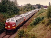 The daily run over, the AC Tour Train is being put away for the night inside Steel Co. property. Five units are 1751, 1755, 1754, 1750 and 1756. They are former VIA 6506, 6530, 6525, 6502 and 6553.