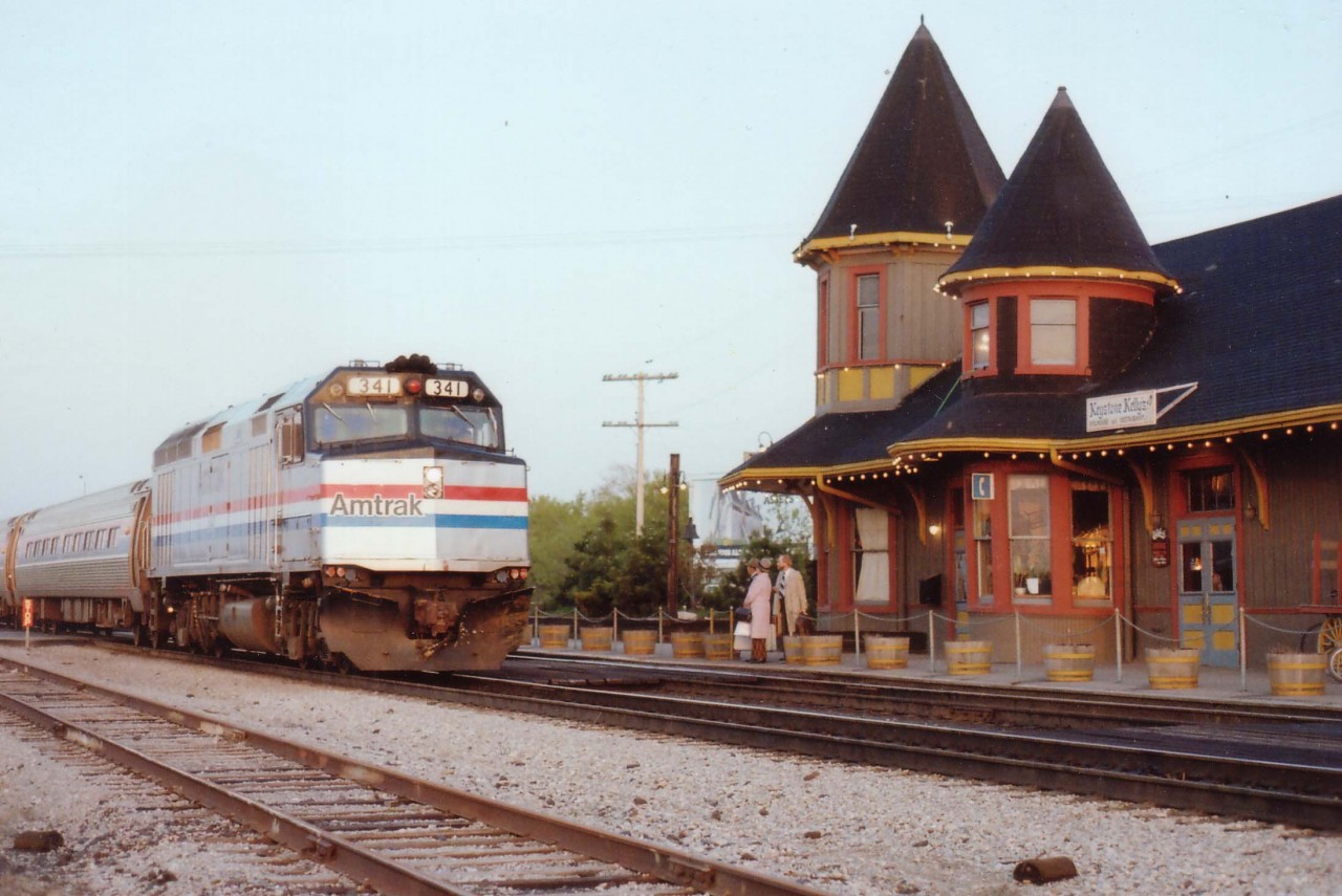 AMTK #98 with 341 slows to a stop at Grimsby Station, as quaint as a movie setting this place was until it was destroyed by an electrical fire on New Years Day, 1991.