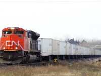 CN 144 with CN 8015 solo leads a long Triple Crown through Woodstock Ontario 