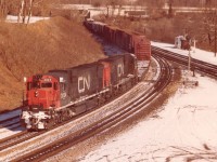 CN train #401 was a daily 'treat' for the fans. You never knew what kind of power would be on it. The railfan routine was to go into Hamilton's Stuart St yard and find out; for in the mornings this train would back out of Hamilton until clear of the Junction at Bayview and then get lined up westward up the Dundas Sub.
Today's CN 2024 and 2000, a pair of C-630Ms made for an eventful chase and I followed this train as far as Paris.
All locomotives in this series were off the CN roster by 1996.