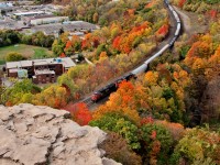As we start into the middle of October mother nature is doing her worst on the colour as a few trees begin to lose there leaves, while others still cling on. The wail of dynamic brakes from a pair of CN units keep 7,317 ft of train in check on the downhill approach to Bayview at the bottom of the grade.