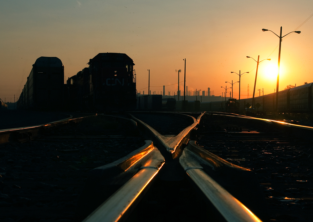 All is quiet in Oshawa at sunrise except for a pair of geep's sitting at the west end of the yard after assembling a ballast train. Ballast was dumped onto the new third main between Oshawa Center and Oshawa West as part of VIA's ongoing infrastructure service expansion along the Quebec City - Windsor route.