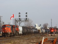 CN 331 rolls through London Jct behind CN 5617-2243. About 25 cars back from the engines was Dofasco #410 riding on a QTTX flatcar riding to NRE Silvis for wreck repairs.