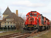 CN 5937 and CP 6030 begin to lift the rail from the Caso Sub. Work has been completed from just east of County Road 8 at the west end of the big curve and eastward to the switch just beyond the station at Essex. All the rail, with exception of road crossings, was towed to the east and clear of the Naylor Sideroad. Work will continue tomorrow (11/16/2012.