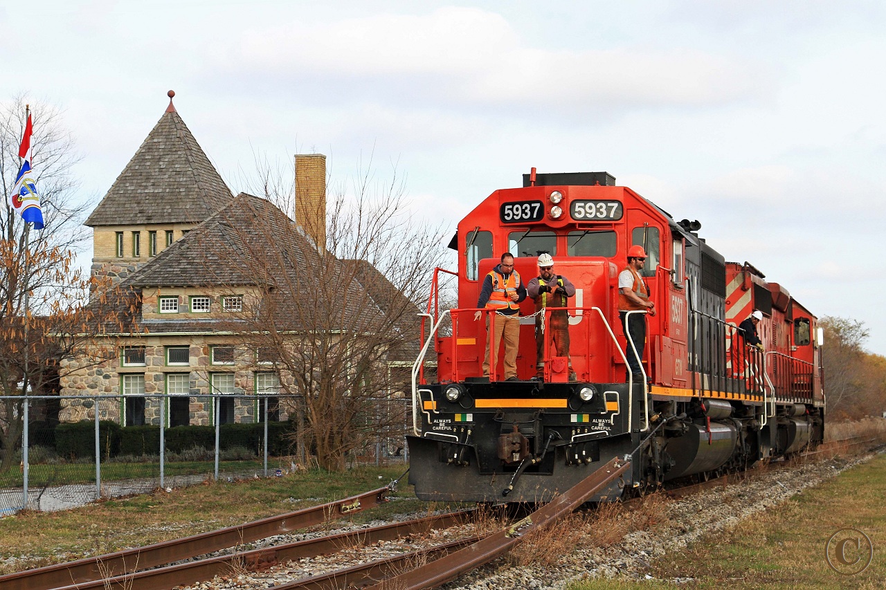 CN 5937 and CP 6030 begin to lift the rail from the Caso Sub. Work has been completed from just east of County Road 8 at the west end of the big curve and eastward to the switch just beyond the station at Essex. All the rail, with exception of road crossings, was towed to the east and clear of the Naylor Sideroad. Work will continue tomorrow (11/16/2012.