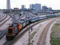 CN 8520 pulls The Canadian out of the coach yard before shoving it to Union Station prior to its cross country journey