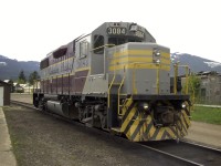 EMD GP38-2 CP 3084 rests in the afternoon sun outside the Revelstoke, BC car shop.  The unit was only in town for a day before it was hauled away to duty.  Even though it is mid-May, snow is still quite evident on the mountain slopes in the background.