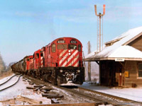 On a day not quite spring, eastbound train #52, with CP 4202, 5022 and 6700 rolls past the old Zorra station. The track on the left veers off to the current La farge cement plant, and off to the right (out of sight) the line to St. Marys existed; now only a spur to a gravel operation.                                  