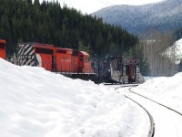 CP 5876 and a trailing 5900 series unit are moving a double ended plow train westbound through Rogers, BC.  There was a Russell wing snow plow and Jordan spreader on each end of the train for bi-direction snow clearing with plenty of power.