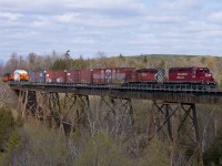 T18 passes over the Cherrywood trestle with a nice surprise at the end of the train. Hydro One's HEPX 200 and HEPX 79640 are destined for the Hydro One plant at the end of the Hornby Spur in Mississauga, ON.