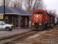 <b>Train time in Chatham:</b> D725 has arrived from Sarnia for the second last time - the Conductor and Brakemen have detrained - one to throw the switch to the CP Interchange, the other to grab paperwork inside the Chatham Depot. In the door to the station, Clerk "Skip" Dunn is greeting the crew upon arrival - Skip being the Clerk who handles paperwork, radios instructions to the crew (car locations, etc) and handles rover duty (using the truck at left). This was the second to last scheduled D725, the last freight operated the very next day (Sunday February 29 2006).
