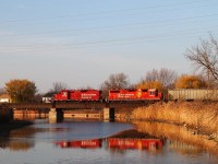 As they make their way westward back to Windsor, CP 8222 and CP 7309 with train T76 cross the Belle River in late afternoon light.