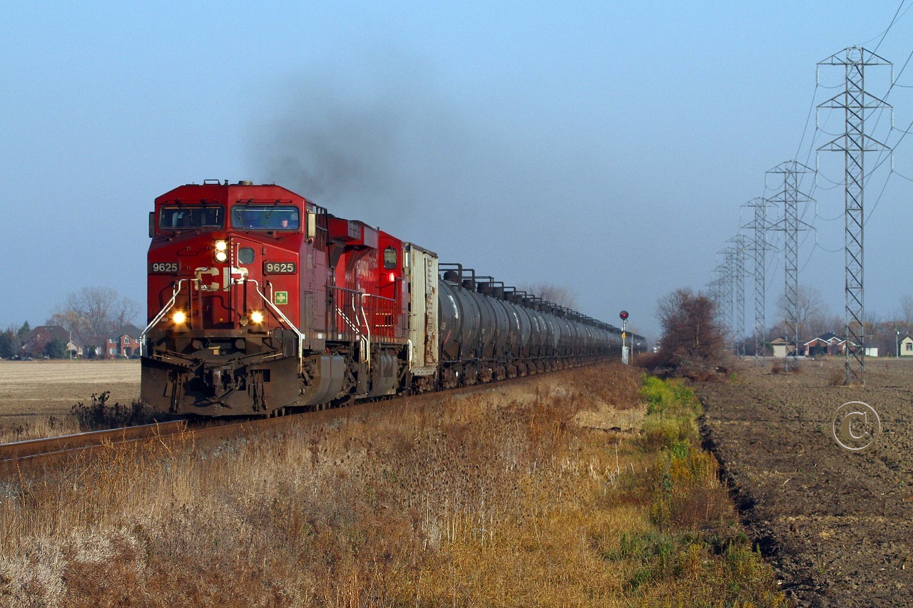 Headed for the border, CP 9625 and 8816 charge westward at mile 98.8 on the CP's Windsor Sub November 16, 2012.
