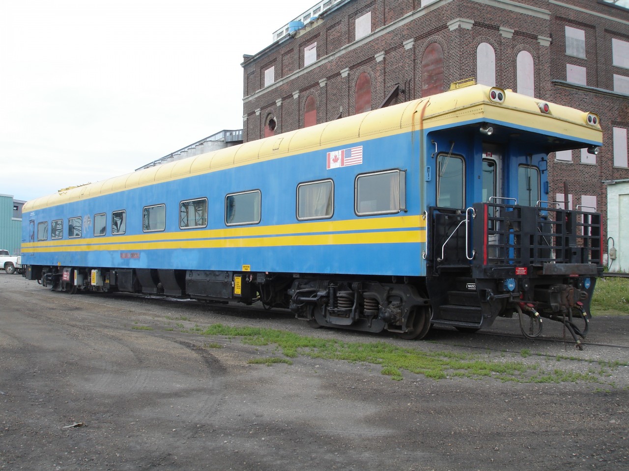 What an interesting find on this July 23, 2008 afternoon in Churchill, MB.  Somewhat imitating a VIA Rail paint scheme with its yellow & blue colours and stripes, this business car was devoid of any identification other than its AMTRAK certification No. 800576, and a stencil above the galley door reading 'Jonathan Wood Oklahoma City, Oklahoma'.  Closer inspection of the car revealed it was last named 'Canadian Sunrise' which allowed me to trace it backwards as ex-NREX 'Royal Adventure', exx-CN 100 'Bonaventure', exxx-CN 90, exxxxx-CN 23.  Built in 1959 it is one year shy of 50 years old.  Photo taken by David Wylie and submitted with permission.