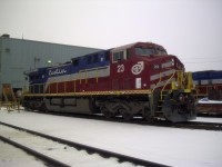 Cartier 23 stands on guard at the Port-Cartier locomotive shop on this dull and overcast November afternoon. While not new, the locomotive shows no signs of its hard use hsuling heavy ore trains.