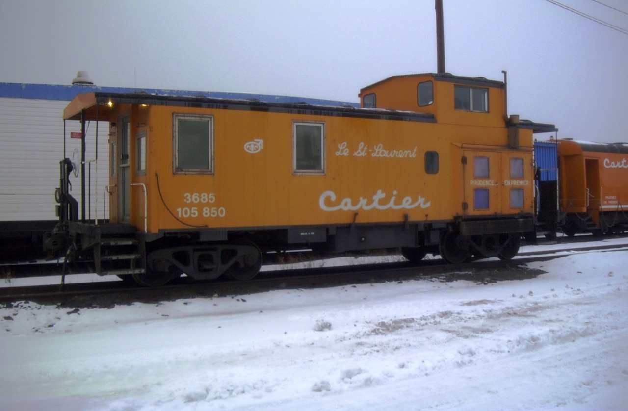 Le St.-Laurent was not sitting far from sister Le Nord-Cotier on this dull and dreary day in Port-Cartier.  The bright orange paint on these two vans, a couple of coaches, and an old Wellman crane were the only bright spots in my afternoon of photo gathering.
