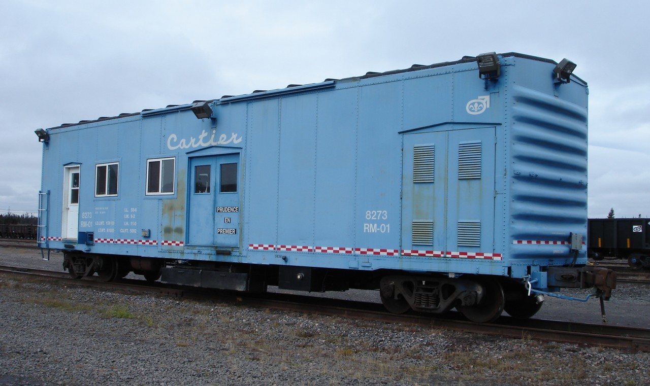 Cartier 8273 RM-01 is a box car modified for road repair service on this remote mining railway.  Equipped with all the tools and equipment needed for day or night 'away-from-shop' repairs, this car is ready to be dispatched on a moments notice.