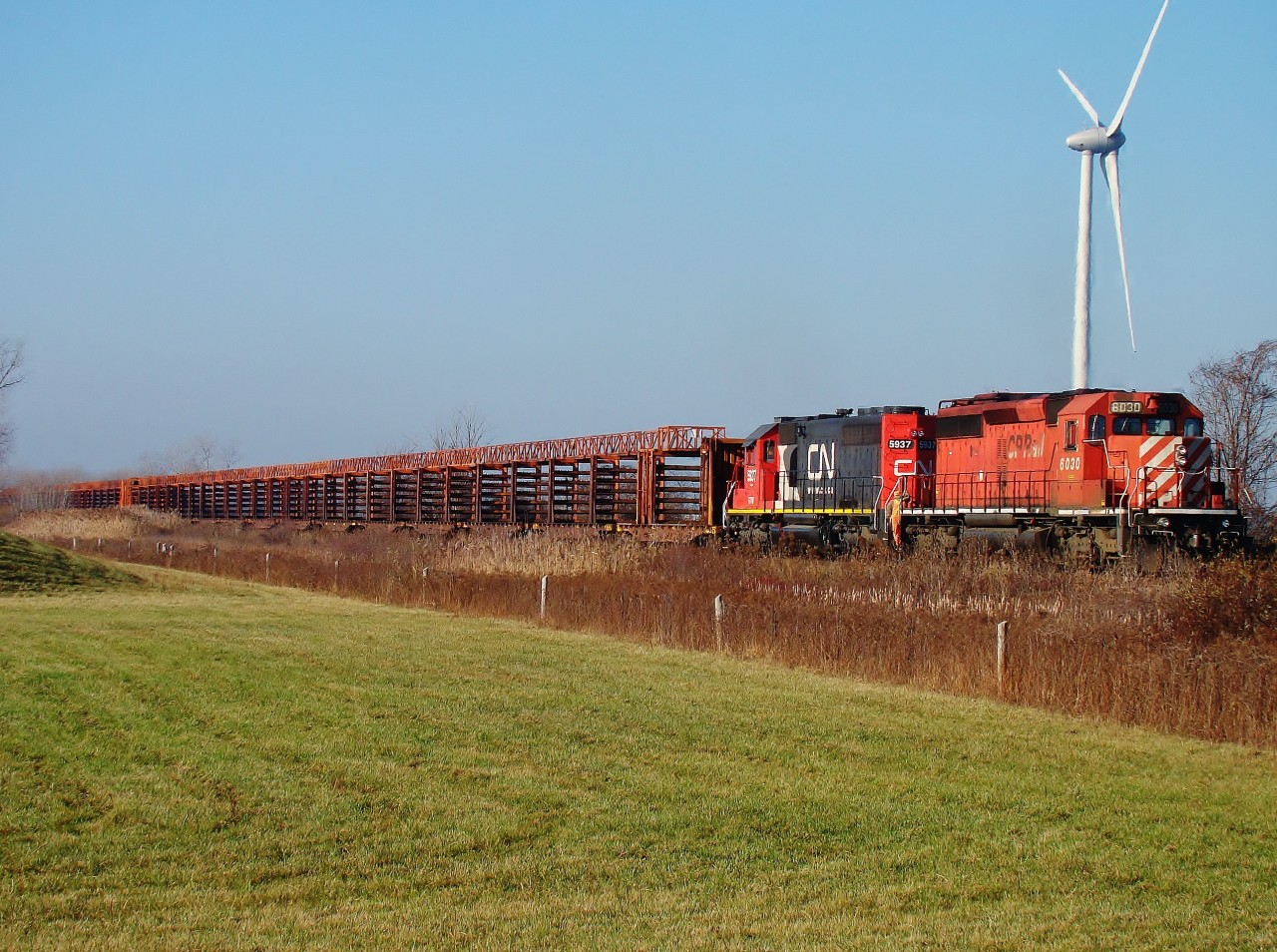 The Rail Train for the CASO slowly backs up to Essex where he will start to pull the first sections of rail onto his train. These rails are now gone to Woodslee, just a few miles east of here.