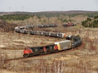 CN 316 - CN 2643 South rounding the curves at Coniston crossing the OVR's share of the Cartier sub to North Bay. 316 has the IC/WC camp train on the head end this morning heading for Washago. 