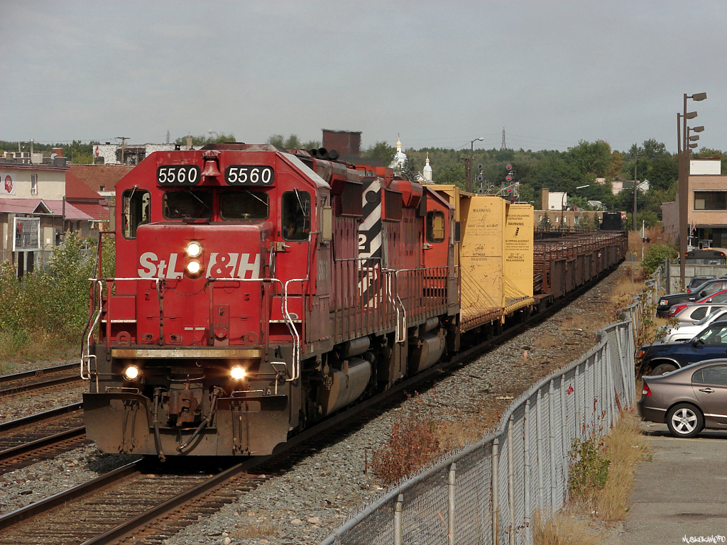 WCA-11 (Work train on the Cartier sub on the 11th day of the month) is seen dumping rail on the North track East of Elm st. with STLH 5560 and CP 5922 for power. The train will finish up here, then head over to Romford to hop on the Parry Sound sub for some drops South of St Cloud.