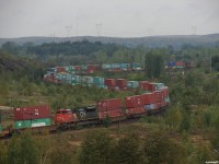 CN Q10131 12 - CN 8889 North seen working his way across the diamond at Coniston. CN 8889 is on the head end, CN 8020 is seen here 41 platforms deep, and CN 8023 is shoving a little further into the train of 147 platforms. 