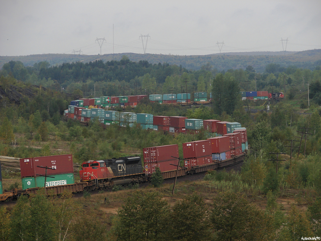 CN Q10131 12 - CN 8889 North seen working his way across the diamond at Coniston. CN 8889 is on the head end, CN 8020 is seen here 41 platforms deep, and CN 8023 is shoving a little further into the train of 147 platforms.