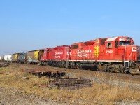 CP T76 led by former D&H 7309 starts to haul eastbound out of the Tilbury siding after CP 241 west had just passed by.