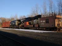 Inspired from an earlier post, I decided to dig through my collection to find this old 200 ton Crane (CP 414479) and Idler (CP 412730). At the time it had been sitting in Thunder Bay for sometime in the "mini-rips" (C-yard) where light repairs were done on cars before CP closed it and moved the operation to their main Thunder Bay shops in 2008. Up for sale by CP, little did I know at the time a local scrap yard had purchased it. Within a couple weeks of taking this photo a yard crew grabbed the old hook and took it to the winning bidder, Lakehead Scrap. 

On a sidenote, the tracks in the "mini-rips" in C-Yard appear they will be sent to scrap yard. Although for the past few years its been used only to store OCS equipment and bad order coal cars in October 2012 the junction switch which led to the small stub yard were locked and OOS (Out of Service).