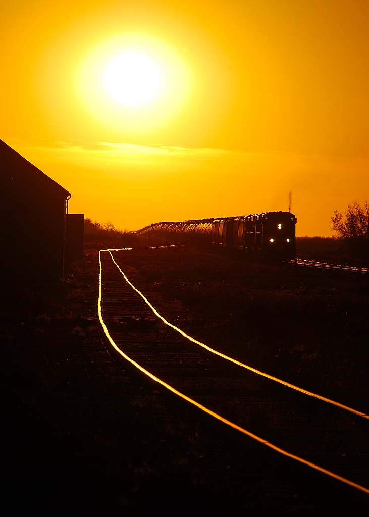 CP 298 departs out of the sunset as it makes it way east out of Wynyard