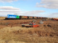 After switching Mobil Grain's small yard in Aylesbury, Mobil Grain 3138 makes it way North towards Saskatoon.