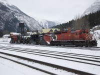 5875 sits with 2 sets of Snow Fighting Equipment at Field B.C captured November 14, 2012.  Wedge Plows and Jordan Spreaders ready to roll east or west with the first heavy snows.