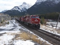 A westward Grain Train with 8916 & 9368 rolls towards Gap to meet a manifest train sitting "in the hole" at Gap siding , west of Exshaw Alberta, November 19, 2012.