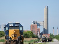 CSX 2574 sits under the impressive stacks of Imperial Oil and the now fallen Dow Chemical Sarnia plant on a sunny June morning.