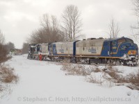 <b>Plow Extra:</b> During the Winter of 2007, strong relentless winds and a couple months of white stuff on the ground caused the ordering of a rare Plow Extra on the Goderich subdivision. During the CN years, this line was well known to host a pair of F units in plow service and was frequented by photographers. With Goderich and Exeter having had transferred two covered wagons of their own from Lakeland and Waterways, the ingredients were ripe for a repeat of the covered wagon plow extra!<br><br>In this frame, the plow extra crew is boarding and preparing their equipment while GEXR 581, seen behind with GEXR 4046 and 3821 and 30 or so cars is backing onto the Exeter sub, clearing the main for the plow to run ahead of it to Goderich.<br><br>The plow would run from Clinton to Goderich, and return to Stratford. More photos from this series to come..